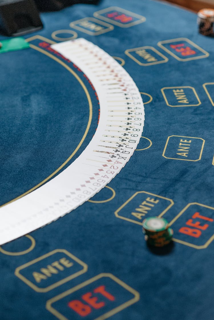 Playing Cards Spread Over The Poker Table