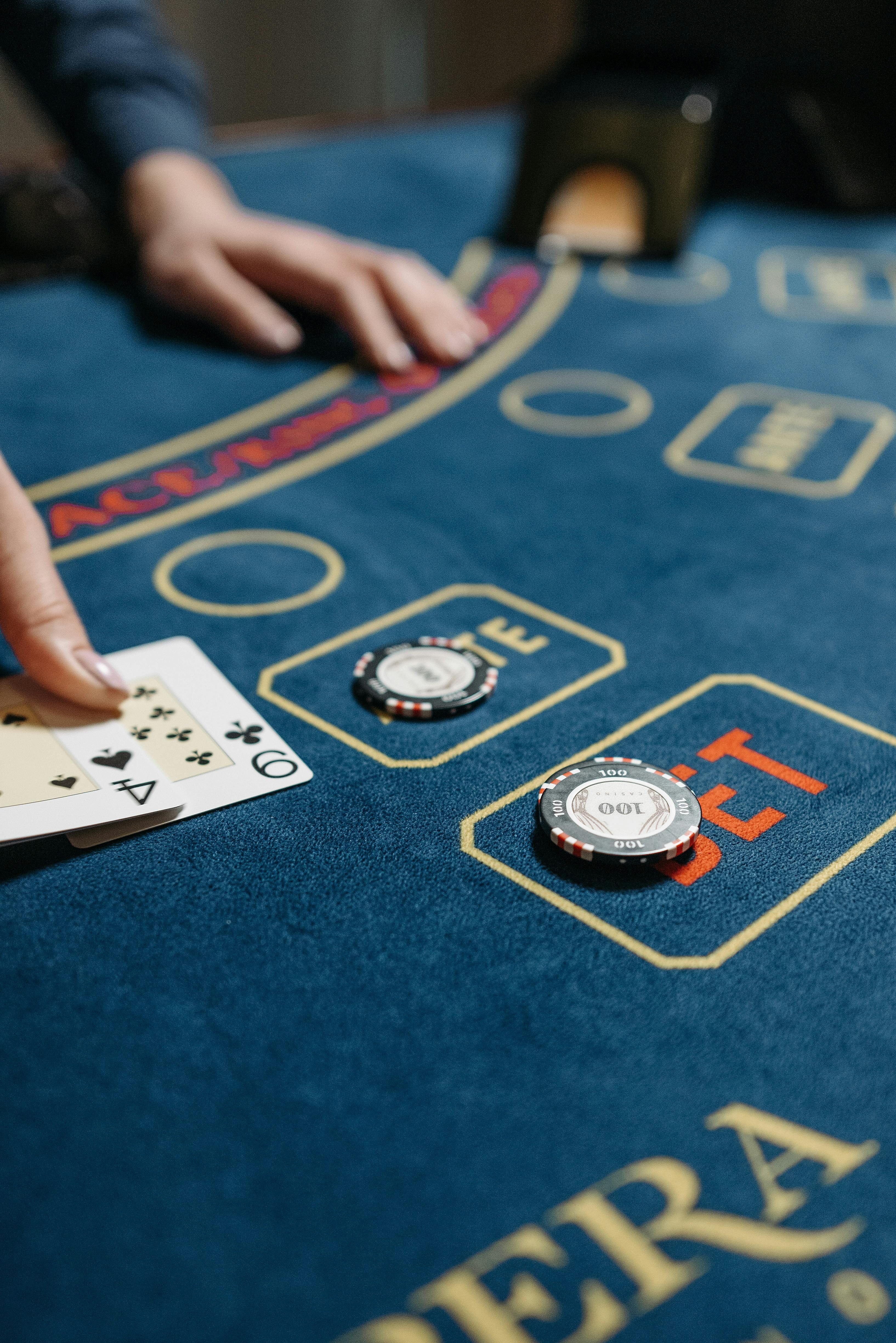 playing cards and casino chips on gaming table