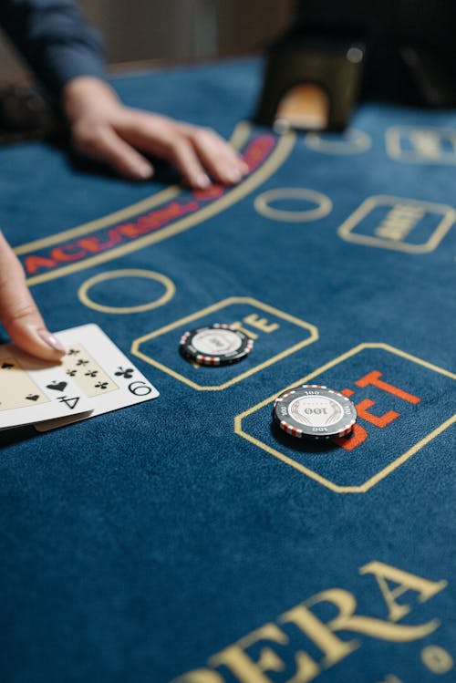 Free Playing Cards and Casino Chips on Gaming Table Stock Photo
