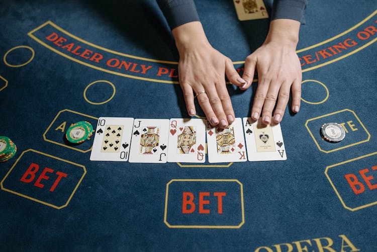 Casino Dealer Hands On Playing Cards