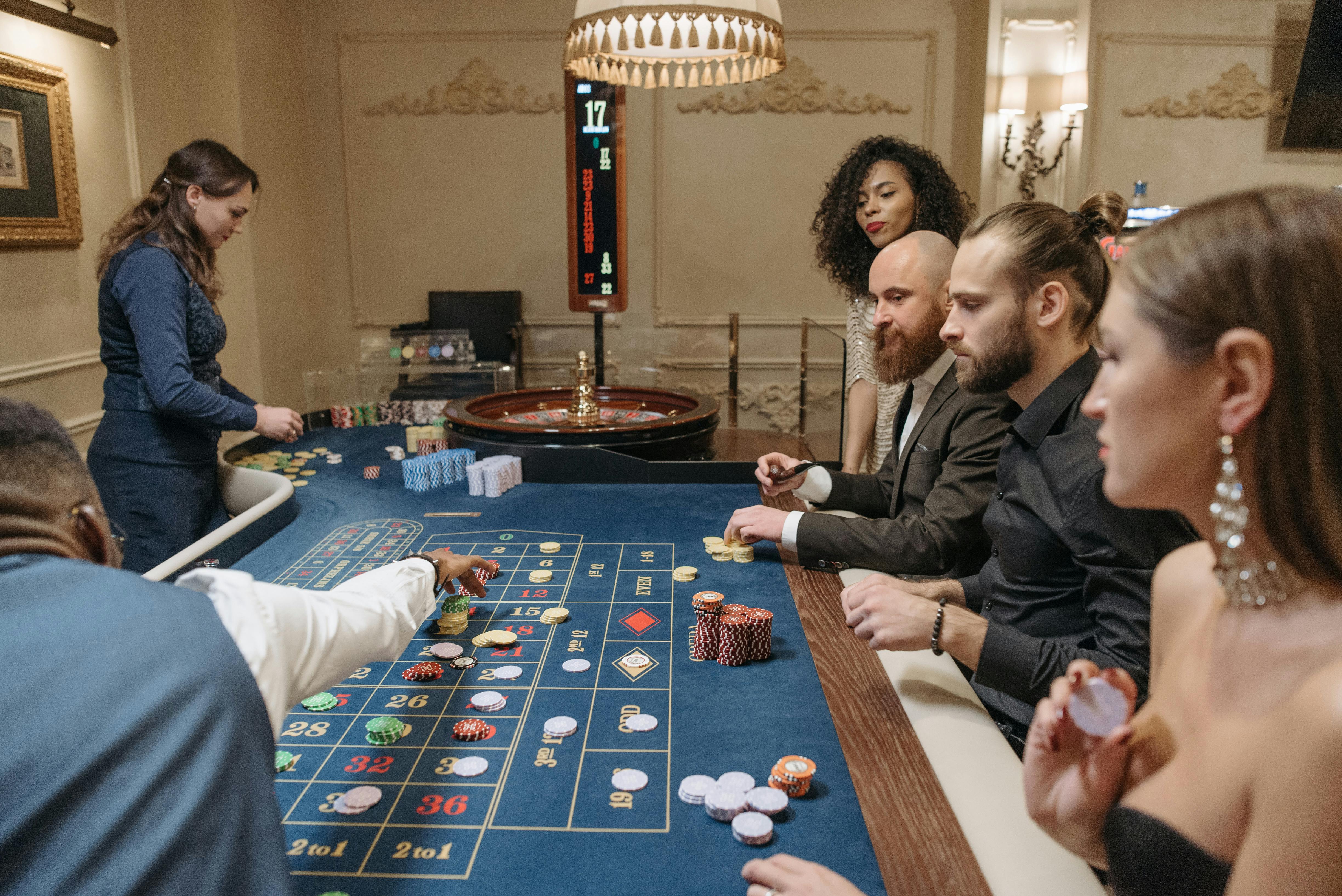 players placing their bets on the roulette table