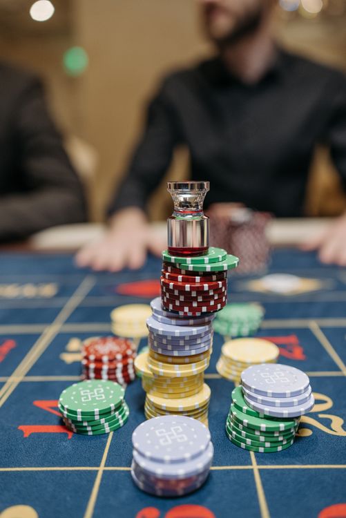 Gambling Coin Stack A Stack of Casino Tokens on Gaming Table · Free Stock Photo