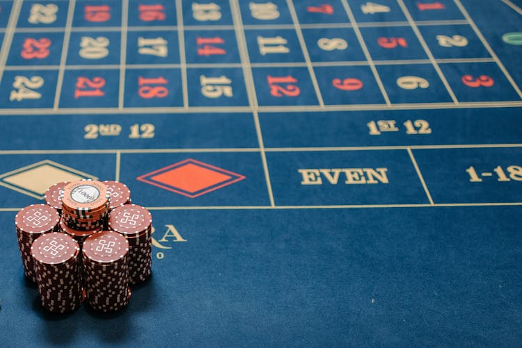 Plenty Of Red Poker Chips On The Table 