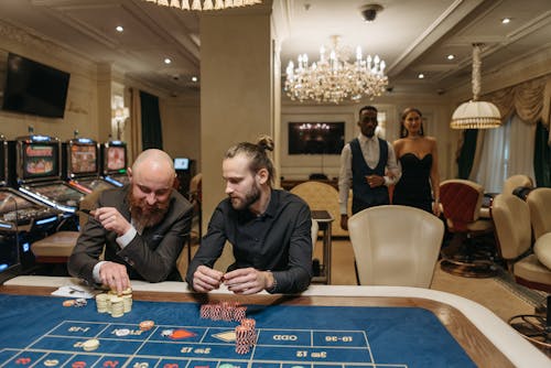 Free Two Men Gambling in the Casino Stock Photo