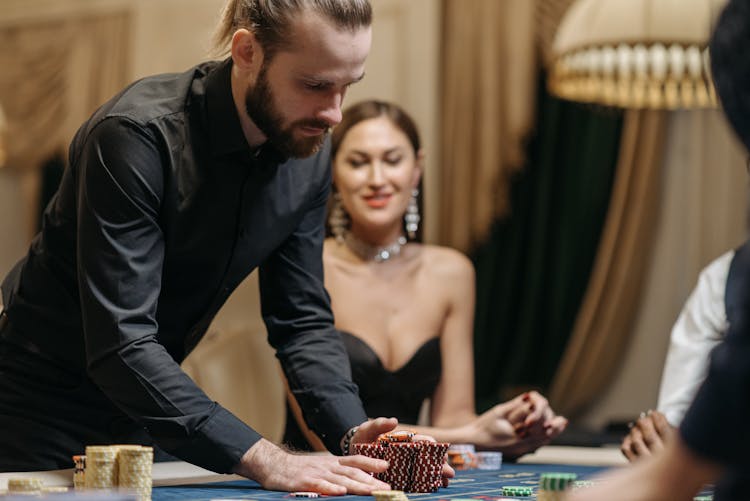 A Man Betting Casino Chips