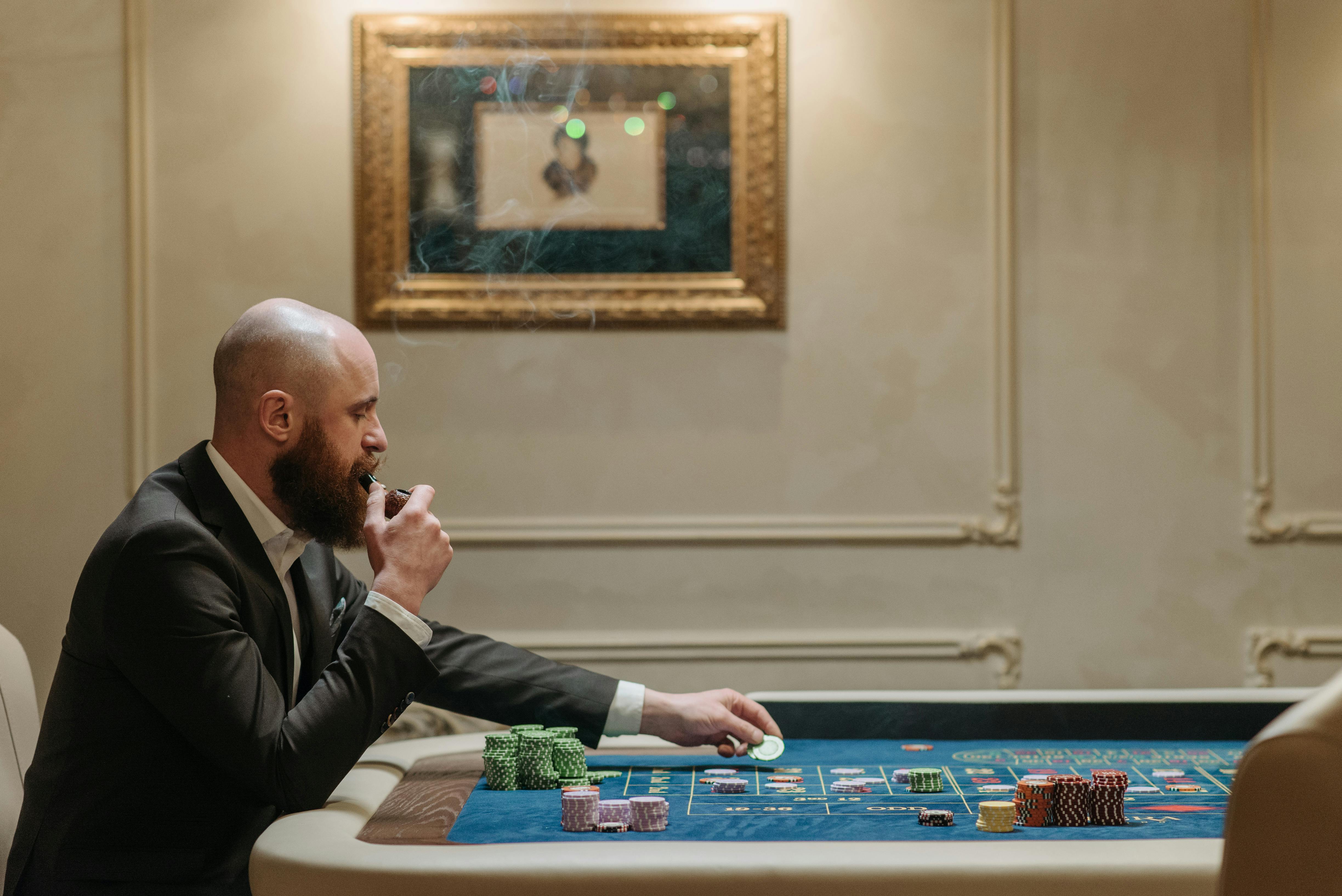 a man placing his bets o the gaming table