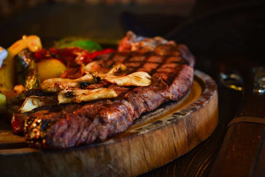 Free Grilled Meat on a Brown Wooden Tray Stock Photo