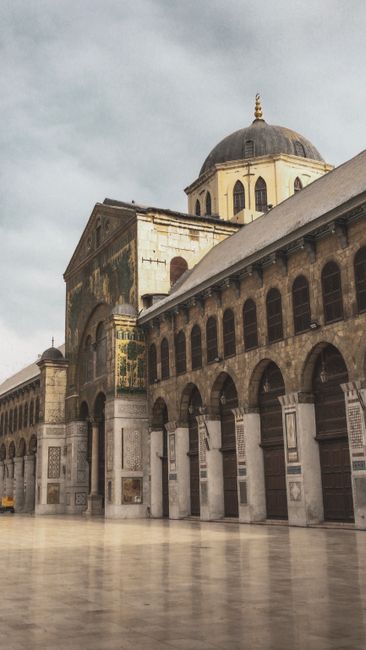 Stunning view of an ancient mosque with a historic dome in Damascus, showcasing its detailed architecture.