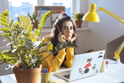 Girl in Yellow Long Sleeves in Deep Thought