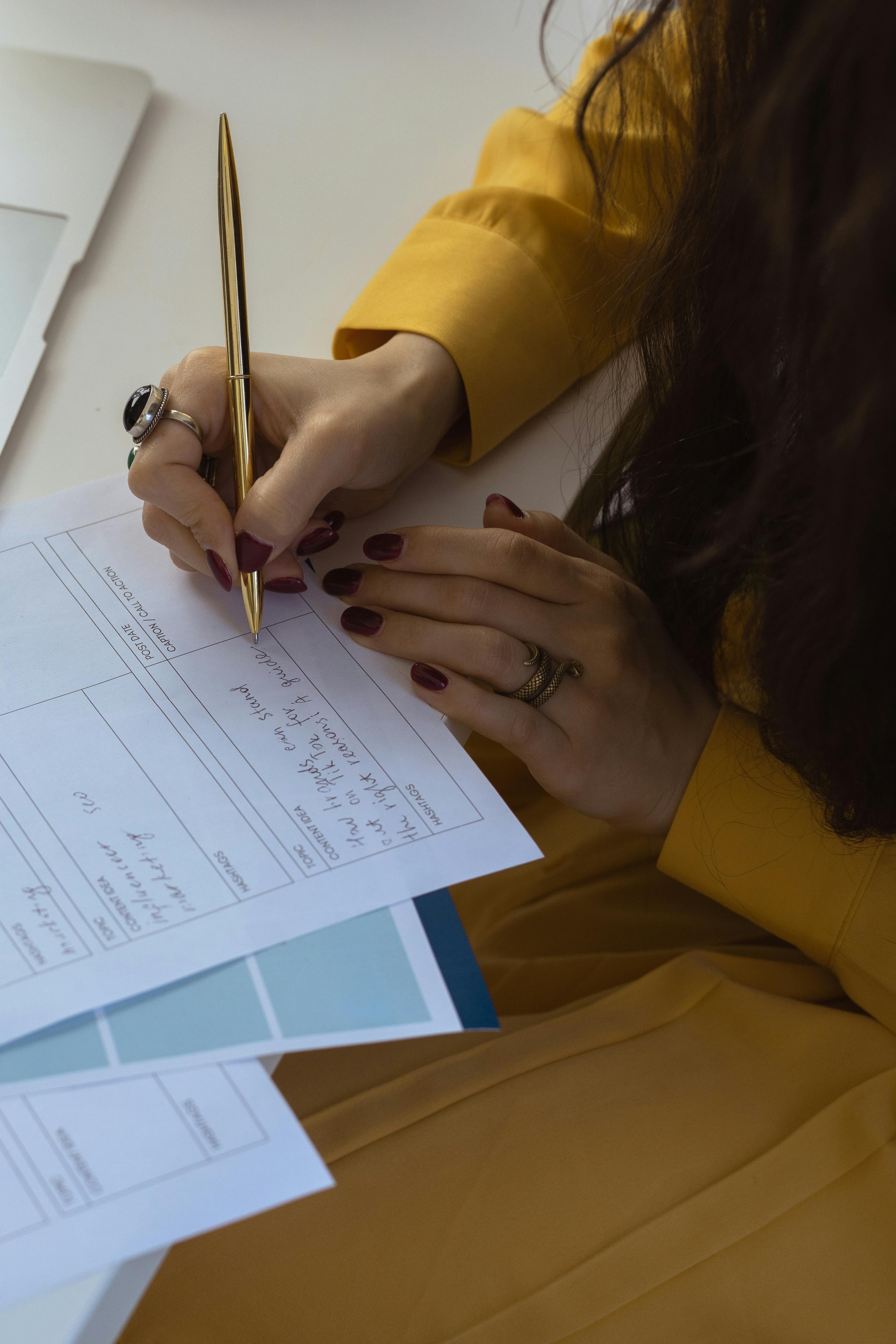 a person writing on paper