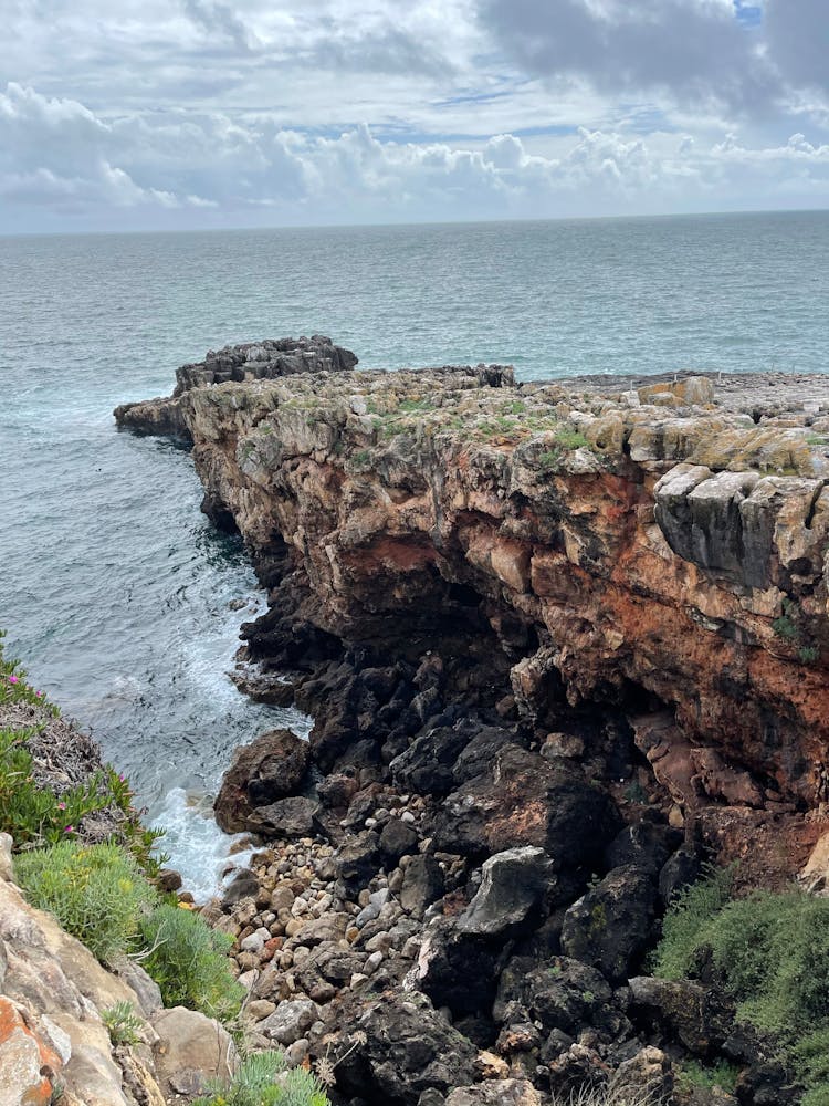 Scenery Of A Rocky Coastline With Eroded Cliffs