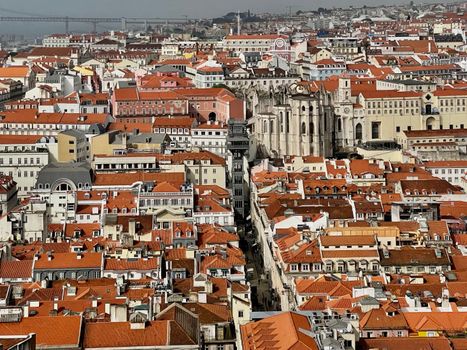 A breathtaking aerial view of Lisbon showcasing its iconic red rooftops and historic architecture.