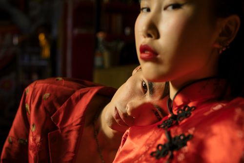 Free Close-up of a couple in red traditional clothing indoors, capturing an intimate and stylish moment. Stock Photo