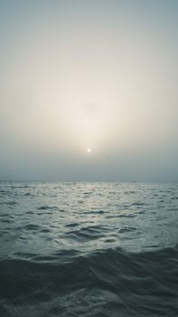 Captivating sunrise over the calm ocean waters of Lagos, offering a tranquil and scenic view.