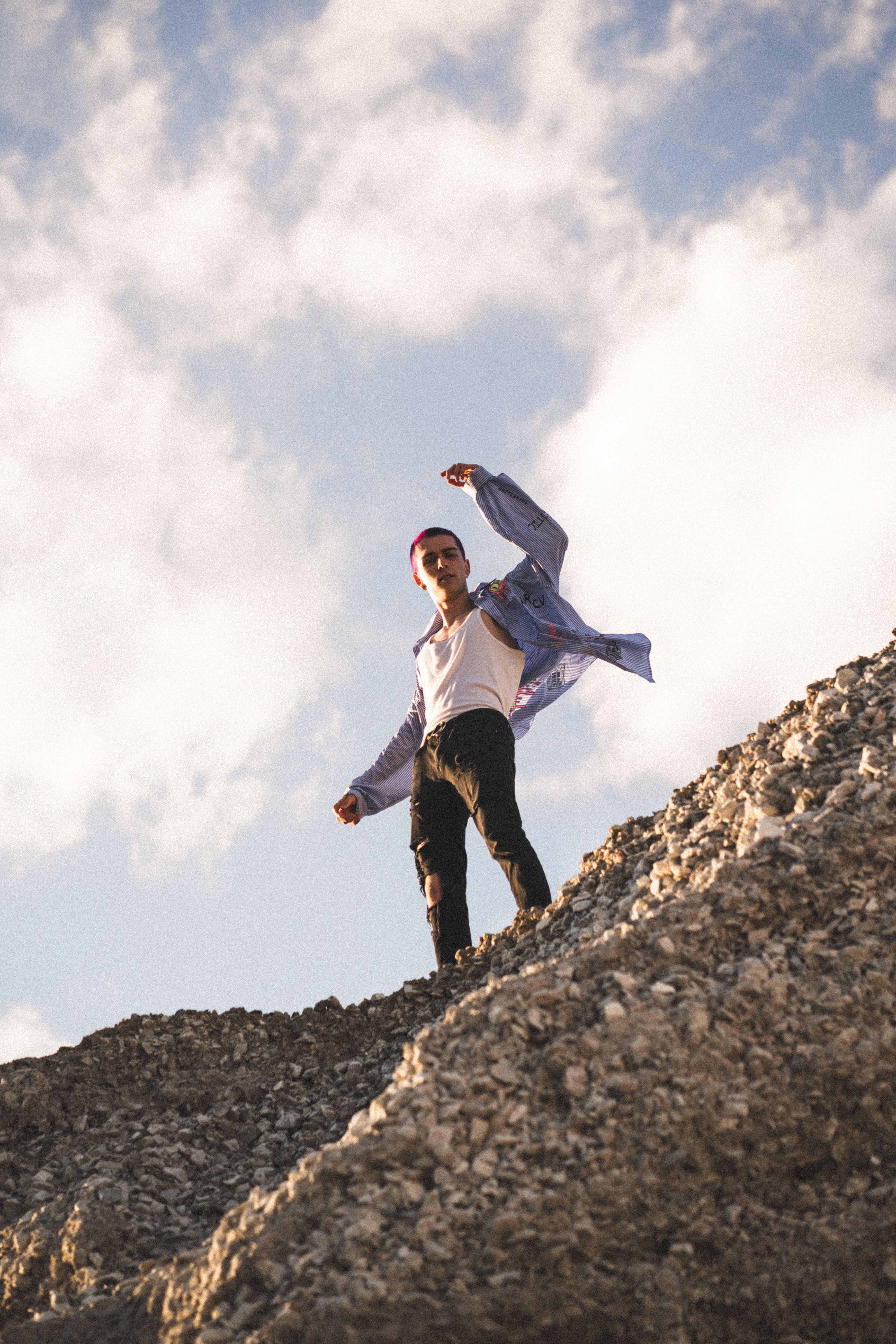 Man Standing on the Top of a Rocky Mountain · Free Stock Photo