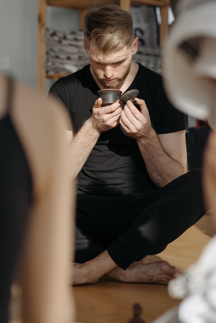 Man Smelling An Object