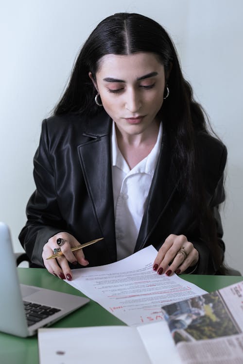 A Woman Editing a Document