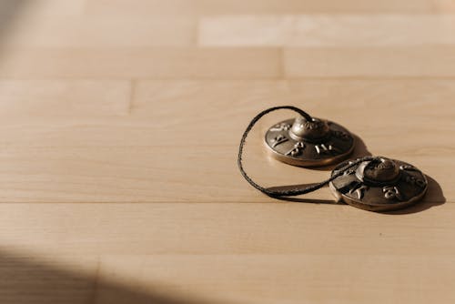 Tingsha Bell on a Wooden Surface