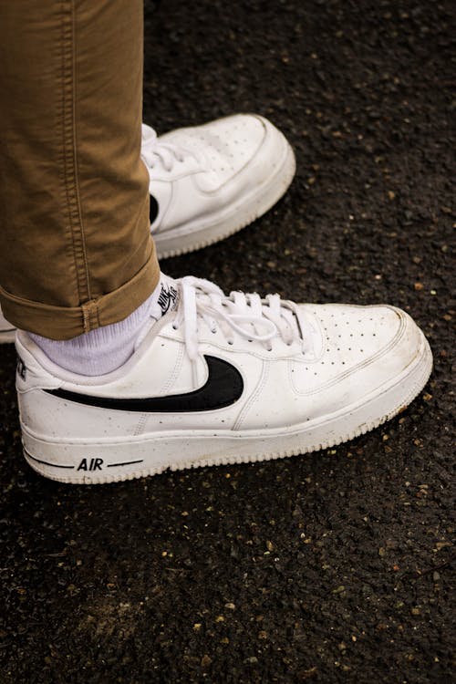 Free A Person Wearing A Pair of Nike Air Force Shoes Stock Photo
