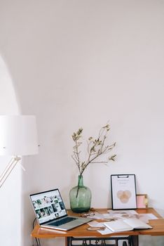 Minimalist workspace showcasing a clean wooden desk with laptop and decor items. Perfect for modern home offices.