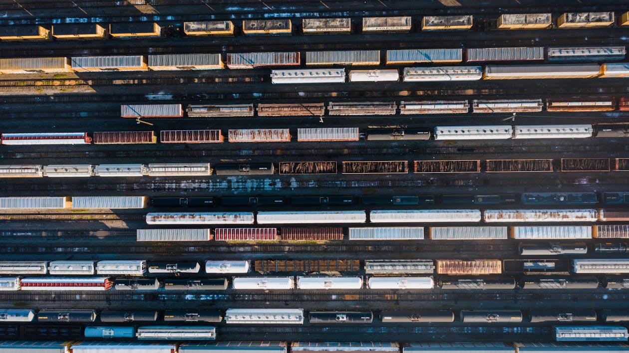 Cargo station with containers in rows