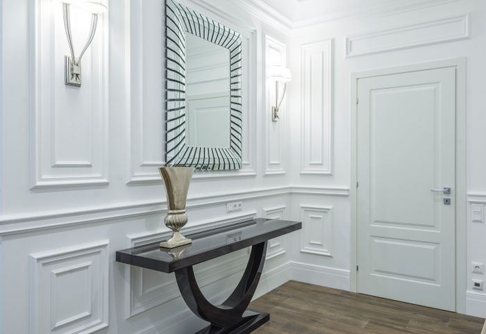 Modern hallway interior showing finished doors and fittings