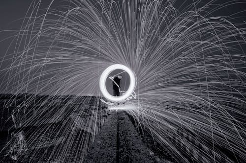 Time Lapse Photography of a Man Standing on Seawall