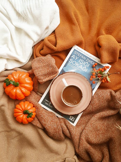 A Cup of Hot Drink Over a Book