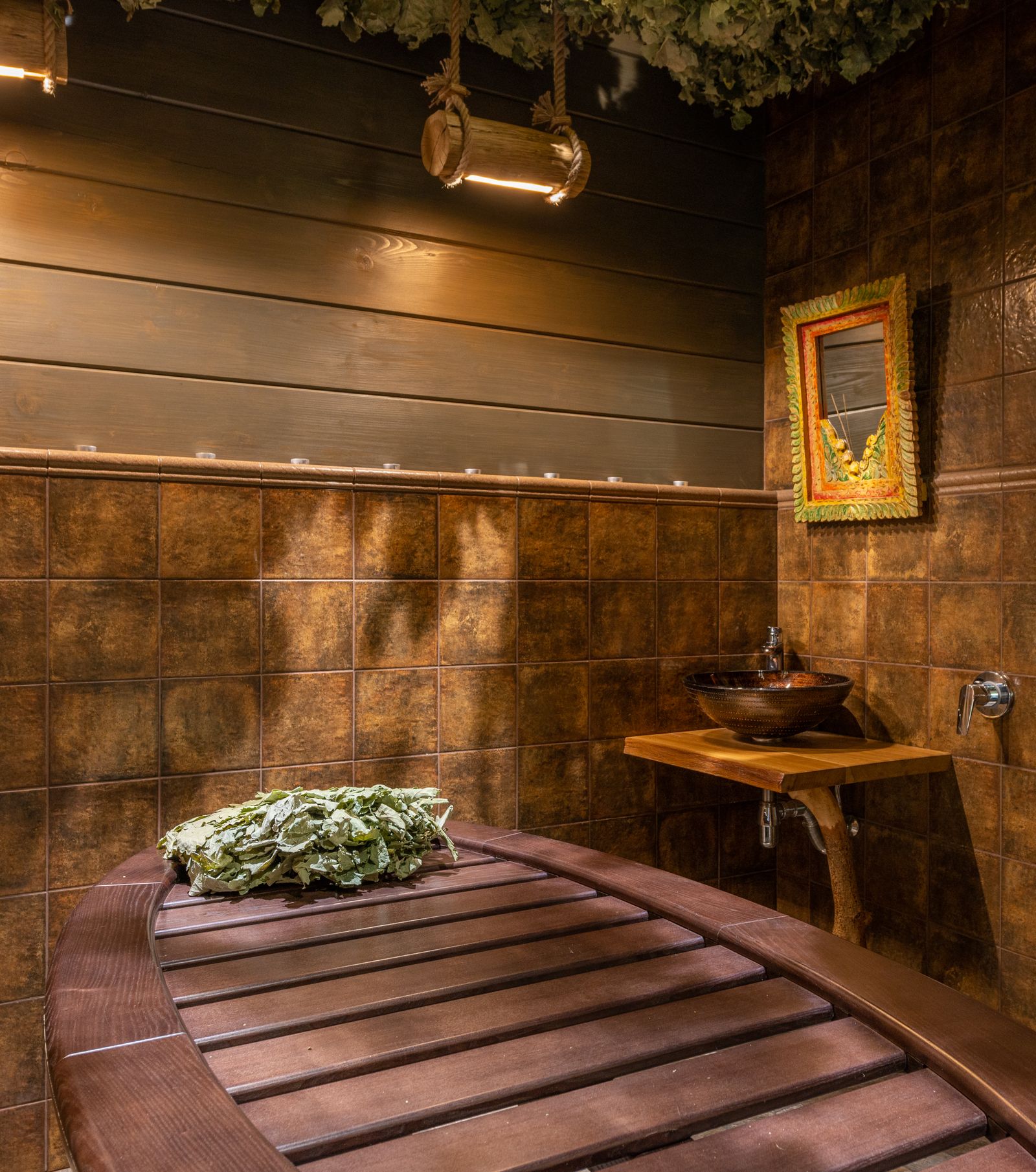 The Aurelia relaxation lounge with warm timber, linen seating and soft candlelight