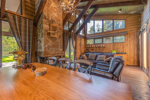 Warm and inviting rustic interior with wooden accents and leather seating.