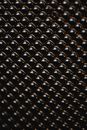 Black and Gold Studs on a Black Surface