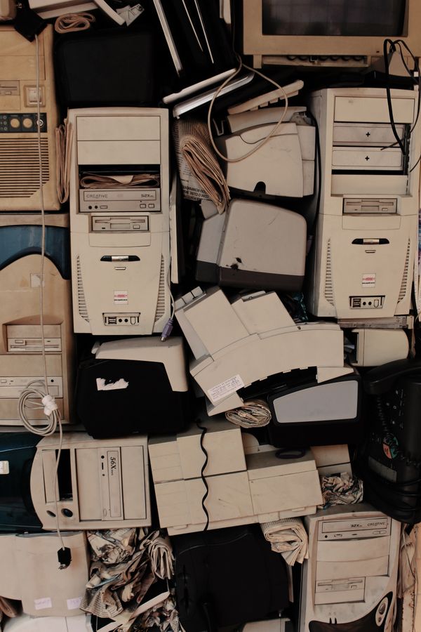 Stack of old, dusty computer equipment