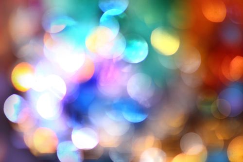 Free Colorful abstract bokeh with vibrant, sparkling circles for creative backgrounds. Stock Photo