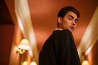 Man in Black Coat Standing