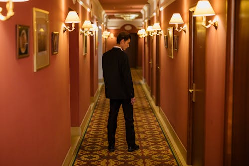 Free Man Standing in the Hallway Stock Photo