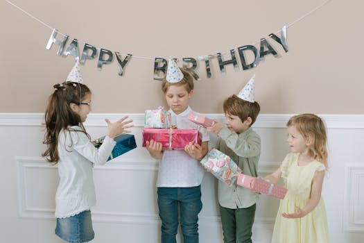 Kids enjoying a birthday party with gifts and decorations.