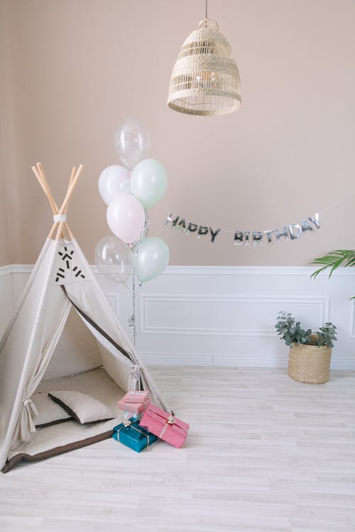 Balloons and Gifts Beside a Teepee