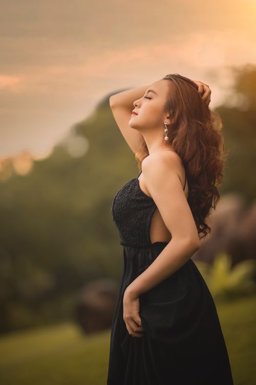 A Woman Wearing a Backless Dress · Free Stock Photo