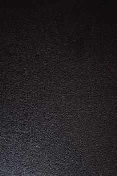 A detailed and textured black surface ideal for backgrounds and design projects.