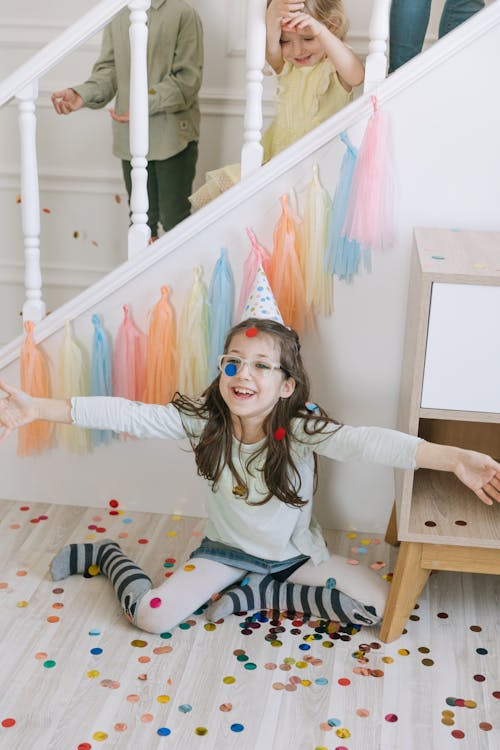 Free children playing with confetti Stock Photo