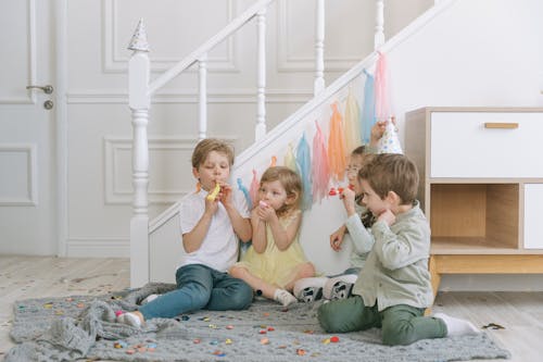 Kids Sitting on a Carpet