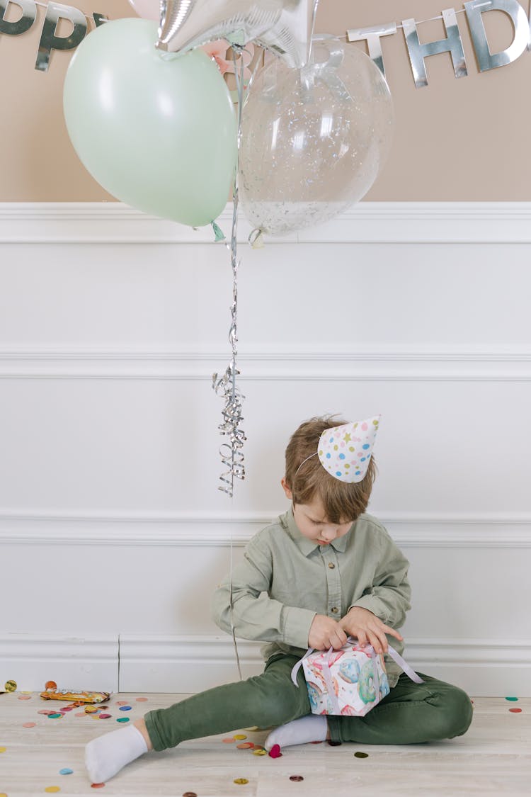 A Boy Opening A Present