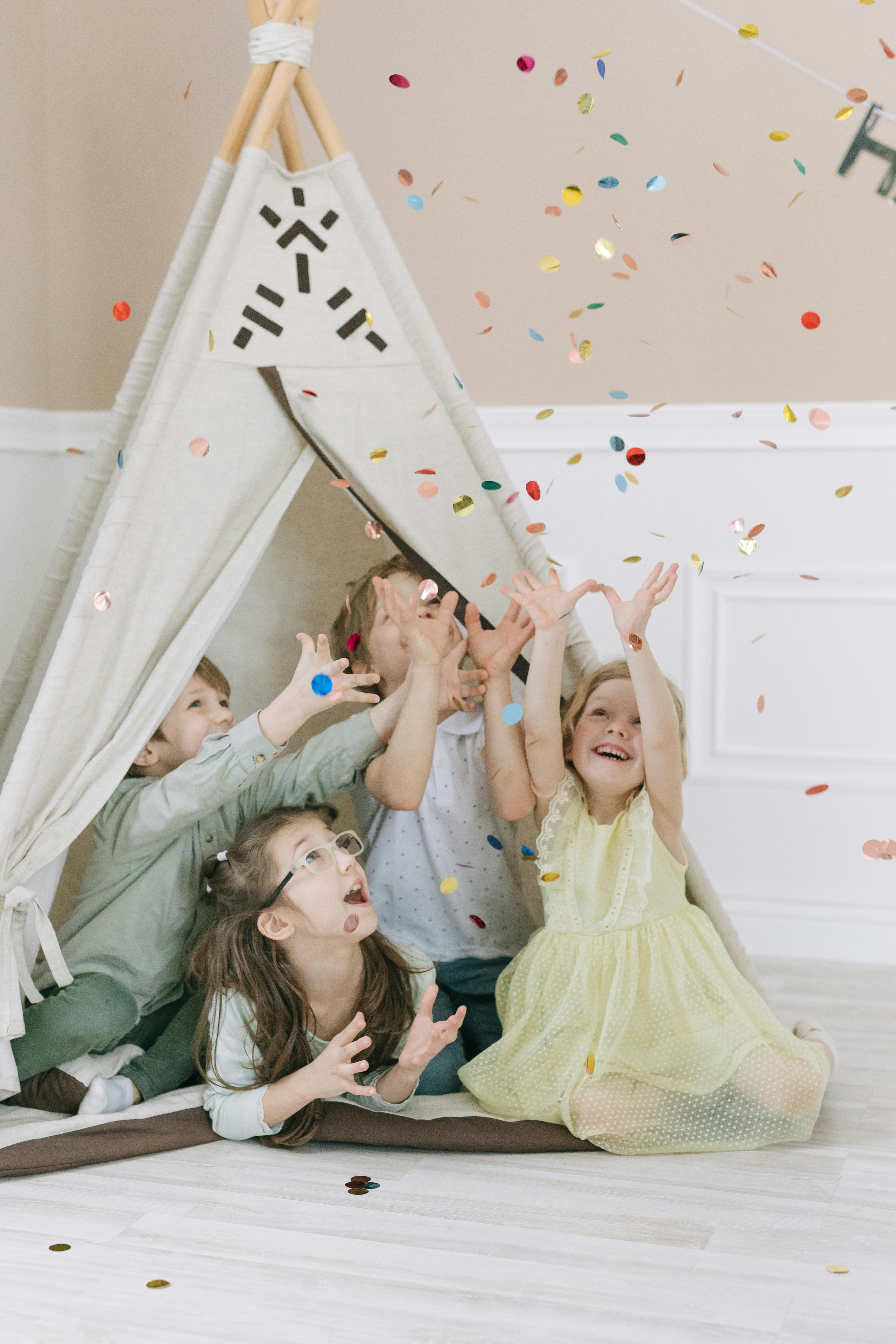 kids inside a tipi tent