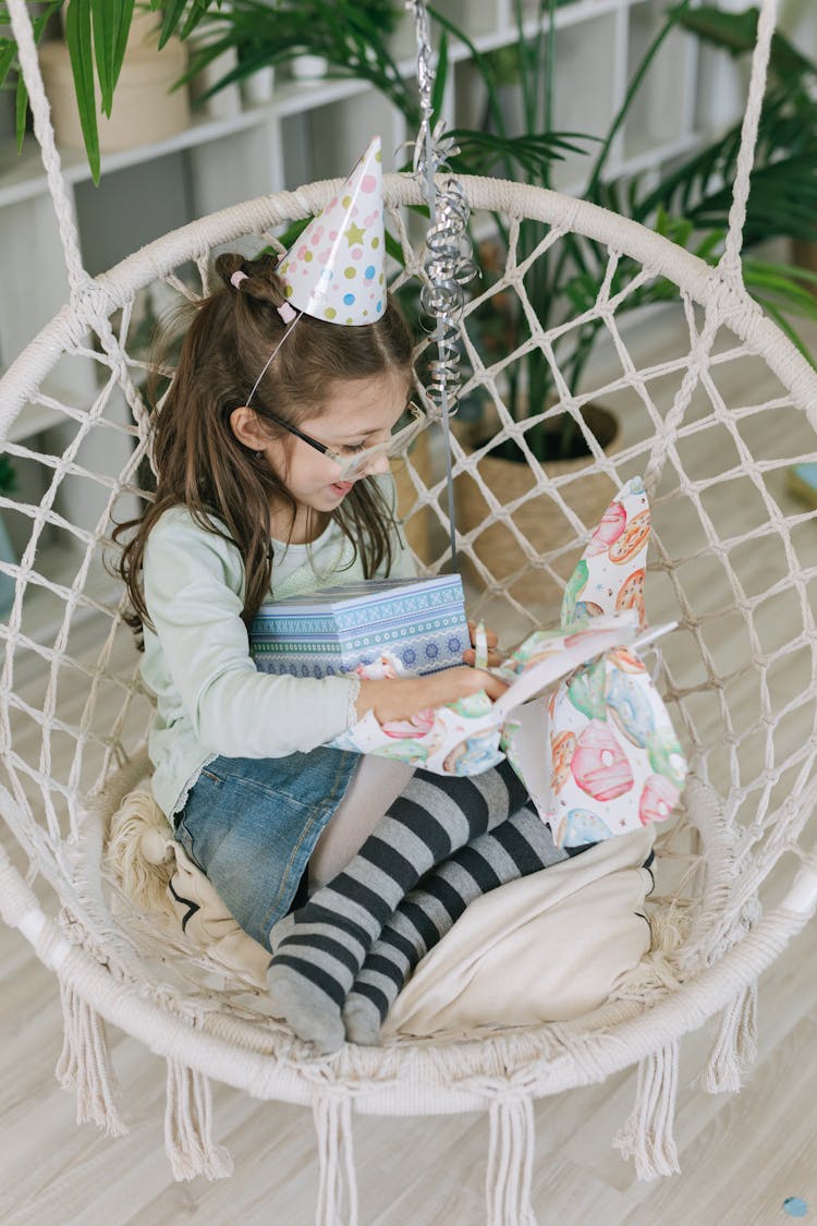 Cute Kid Holding A Birthday Gift