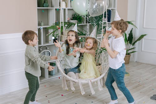 Free Children Playing Together Inside the House Stock Photo