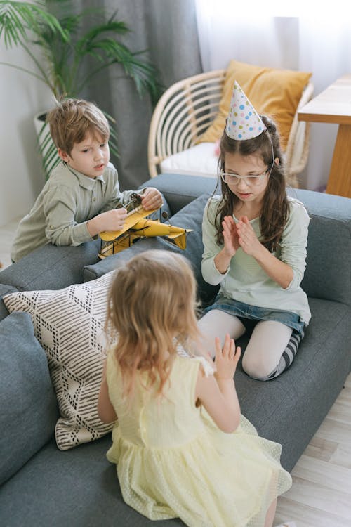 Children Playing on a Couch