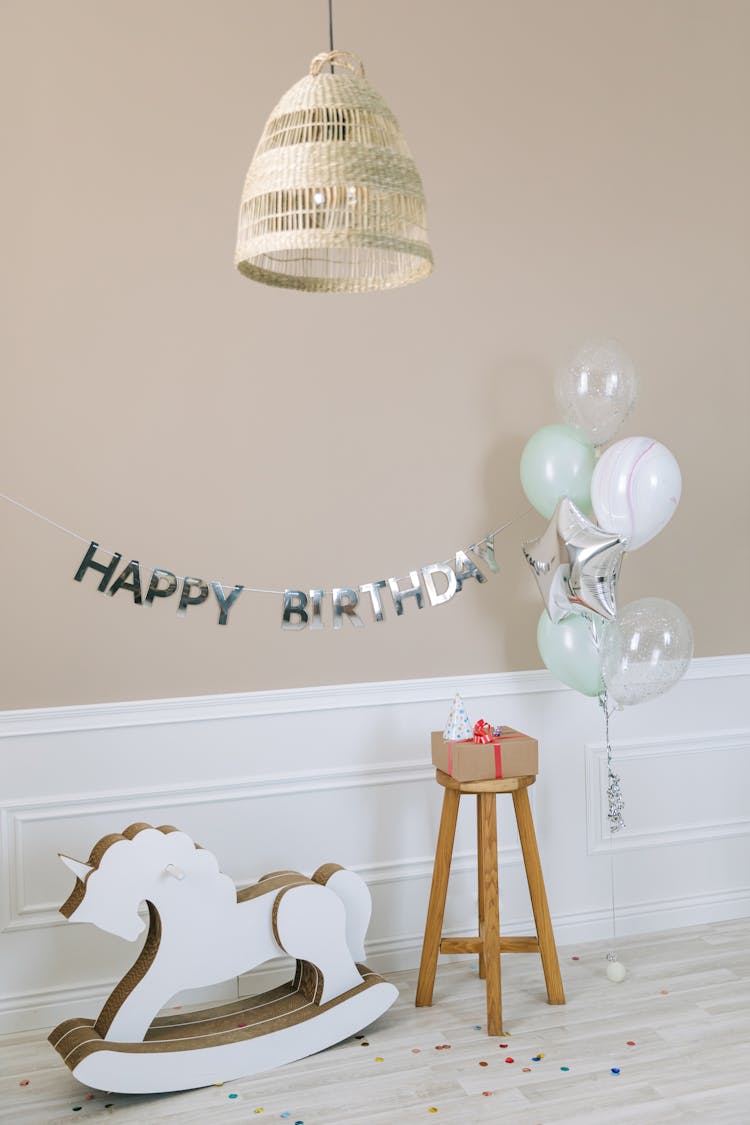 A Rocking Horse And Birthday Decorations