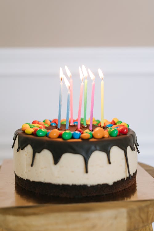 A Cake with Lighted Candles