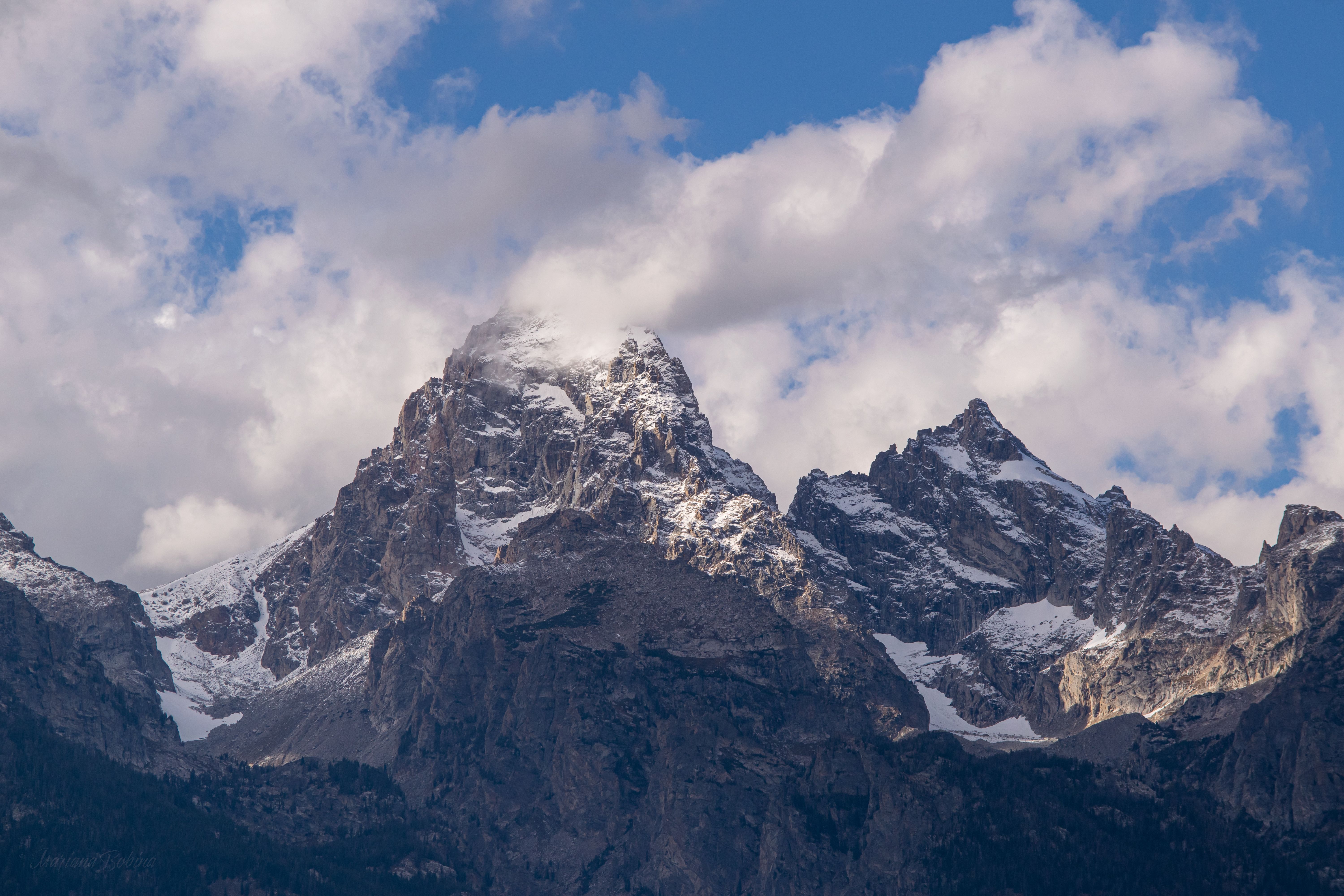 A Snow Covered Mountains Under Cloudy Sky · Free Stock Photo