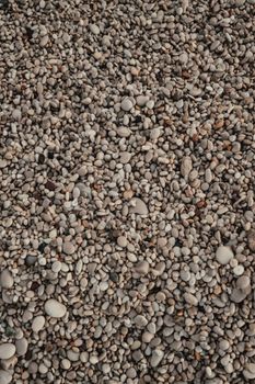 Close-up of a natural pebble stone texture, perfect for backgrounds and design projects.